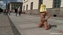 Little Romanian babe Amabella is chained and left down on knees posing in public square then analfucked by big dick Zenza Raggi all over town